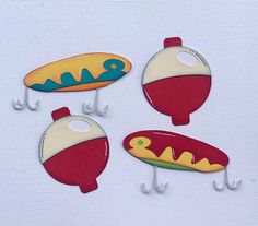 three hotdogs and a hot dog hangers on a white surface with hooks