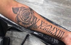 a person with a rose tattoo on their arm