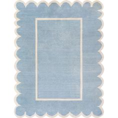 a blue rug with scalloped edges and a square in the center on a white background