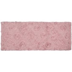 a pink rug with roses on it