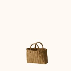 Have you been after the perfect wicker tote? Us too, and the search seemed endless--until now. This tote is durably constructed and impossibly chic, in both it's beige and brown natural rattan. Sartorial simplicity and irresistible utilitarian charm make the Small Underwater Woven Tote a versatile fashion accessory for day, evening, or a special occasion. Unique and sturdy wrapped handles allow for comfort. Enjoy color variations in the natural rattan fibers. Available in natural and smoked ratt Beige Rectangular Straw Bag With Intrecciato Weave, Natural Straw Bag With Intrecciato Weave And Top Handle, Basket-shaped Straw Bag With Intrecciato Weave, Rectangular Straw Bag With Intrecciato Weave, Natural Straw Bag With Intrecciato Weave For Daily Use, Basket-shaped Straw Bag With Intrecciato Weave For Shopping, Beige Basket Bag With Intrecciato Weave, Beige Straw Bag With Intrecciato Weave And Top Handle, Daily Use Straw Bag With Intrecciato Weave