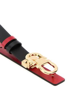 Reversible belt realized in smooth calf leather characterized by metal Gancini buckle. - Adjustable snap-fit closure - Contrasting interior Composition: Exterior: 100% Calf Finishing: Golden metal | Ferragamo Women's Black Leather Reversible Belt in Black/Flame Red | SS24 Interior Composition, Black Flame, Reversible Belt, Genuine Leather Belt, Leather Belt, Calf Leather, Genuine Leather, Black Leather, Composition