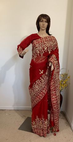 Product code-SA23 Muslin blood red designer bridal Saree for Women Fancy Party Wear.Heavy wide golden zari,Stone, karchupi hand work saree with stitched embroidered red full sleeve Blouse Falls,Picu, piping tassel work nicely done  * Saree Length: - 5.6 Meter * Blouse- stitched size 38-40  * Blouse is stitched. Saree colour-Blood red * Saree Comes with stitched Blouse piece. Embroidered Pre-draped Saree With Long Sleeves For Reception, Red Resham Embroidery Pre-draped Saree For Wedding, Anarkali Long Sleeve Pre-draped Saree For Diwali, Dola Silk Saree With Zari Work For Receptions, Fitted Kundan Pre-draped Saree With Zari Work, Traditional Red Pre-draped Saree With Resham Embroidery, Bollywood Style Long Sleeve Sharara In Organza, Embroidered Long Sleeve Georgette Lehenga, Long Sleeve Organza Choli With Zari Work