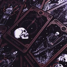 four tarot cards with skulls on them in black and white, surrounded by stars