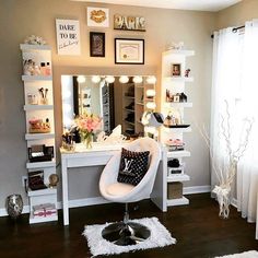 a white chair sitting in front of a mirror on top of a table next to a vanity