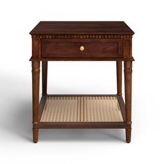 a small wooden table with a drawer on the top and wicker flooring underneath it