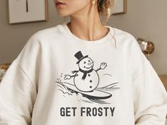 Unleash the cool with our exclusive Vintage Snowman Surfing series, where frosty meets fabulous. Featuring a laid-back snowman catching waves in a classic style, spreading smiles and snowy stoke all around. Production time: 1-3 days Shipping time: 2-7 days ( Please note shipping to certain international countries outside of USA could take longer ) Bella+Canvas Unisex T-shirt features: - High Quality Materials : soft and comfortable fabrics like combed and ring-spun cotton - Stylish Modern Design Snowman Sweatshirt, Snow Man T Shirts, Surfing Crew Neck T-shirt With Sublimation Print, Cotton Surfing T-shirt With Screen Print, Casual Crew Neck T-shirt For Snowboarding, Pocket Pouch, Vintage Looks, Unisex Sweatshirt, Color Matching