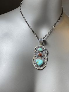 "Artisan Turquoise and Mexican fire Opal pendant Hand-made Sterling Silver 925. Stones used: Turquoise (Nevada), Mexican Fire Opal. Height -3\" (including bail), Width - 1 1/4\" Height - 75mm (including bail), Width - 35mm Unique Handcrafted One-of a-kind Design Pendant Each Piece of Jewelry in my Collection is Absolutely One of a Kind! When you start wearing a piece of my jewelry you will fall in love with it more and more each day and feel that good Energy and Love that I pass into it while cr Artisan Turquoise Rectangular Pendant Jewelry, Hand Forged Turquoise Pendant Necklace, Sterling Silver Turquoise Necklace With Stones, Artisan Jewelry With Gemstone Flower Pendant, Artisan Gemstone Jewelry With Flower Pendant, Unique Natural Stone Flower Pendant Jewelry, Unique Flower Pendant Jewelry With Natural Stones, Unique Hand Forged Jewelry With Rectangular Pendant, Unique Hand-forged Rectangular Pendant Jewelry