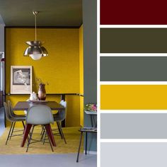 a dining room with yellow and gray walls