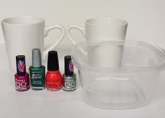 various nail polishes and cups on a table