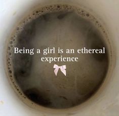 a coffee cup with the words being a girl is an ether experience