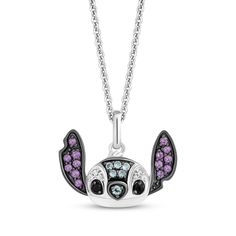 Celebrate your ohana, whoever they may be, with this perky necklace from the Disney Treasures collection—featuring Stitch from Disney's Lilo & Stitch. Sterling silver with black rhodium The pendant showcases Stitch's head and ears shimmering with vibrant round-cut amethysts and Swiss blue topazes Diamond accents and black onyx eyes add more sparkle 17-inch cable chain with 2-inch extender; spring ring clasp Exclusively available at KAY Jewelers © Disney Engagement Ring Style Guide, Diamond Shaped Engagement Ring, Onyx Eyes, Mens Wedding Rings Gold, Kays Engagement Ring, Gold Layered Bracelets, Neil Lane Engagement Rings, Pearl Diamond Jewelry, Disney Treasures