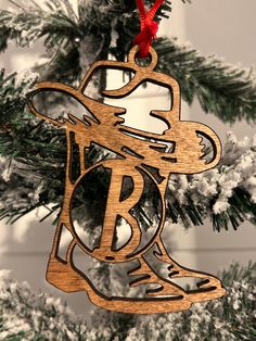 a wooden ornament hanging from a christmas tree