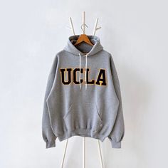 90s University of California UCLA hoodie/ XL * PLEASE READ BEFORE PURCHASE * PLEASE consider the PHOTOS before making the decision * The images may DIFFER in appearance from the actual product because we took pictures under daylight.  * PLEASE send your PHONE NUMBER after your purchase for the shipping company to contact you X No returns X No refund Condition : 9/10 More details : look at the pictures  Brand : Russell Size : XL Pit to pit/ Chests : 26/52 inches  Length : 28.5 inches  Material : Oversized Hoodie With Ribbed Cuffs For College, Varsity Hoodie With Drawstring Hood For College, Urban Style Letter Print Hoodie For College, Oversized Winter College Hoodie, Oversized Winter Hoodie For College, Oversized Vintage Hoodie For Fall, Urban Sweatshirt With Double-lined Hood For College, Collegiate Hoodie With Drawstring Hood, 90s Style Streetwear Sweatshirt With Drawstring Hood