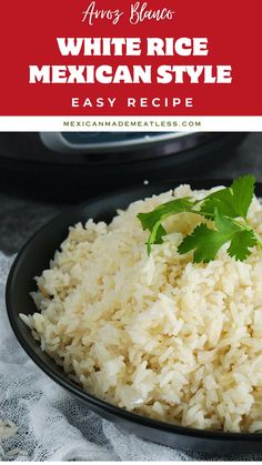 mexican rice in a black bowl with cilantro garnish on the side