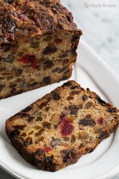 two slices of fruit bread on a white plate