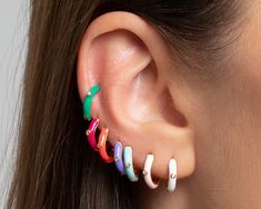 "Available in six colors: Red, Fuchsia, Pink, White, Blue, Green. Huggie hoops enamel multicolor 18 carat gold plated / 925 sterling silver. These tiny hoop earrings are perfect to wear everyday and add a chic touch to your daily outfits. Handmade from gold plated 18k 925 sterling silver with cubic zirconia stones with a colorful enamel. These delicate earrings are perfect to wear alone or stack them with other earrings. I like how it's minimal enough for everyday wear. Hypo-allergenic, lightwei Earrings Huggies, Tiny Hoop Earrings, Cz Earrings, Enamel Earrings, Hand Crafted Gifts, Delicate Earrings, Huggie Hoop Earrings, Fuchsia Pink, Jewelry Earrings Hoops