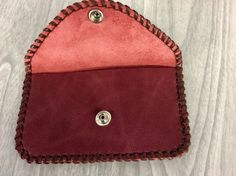 "You have a choice of barn red, army green, or off white of the credit card purses made of cowhide leather. Metal snap and hand laced with leather calf lace and hand stitched for more strength. So double the strength. Enlarge the picture and you'll see the neat hand stitching around the purse. Measures about 5\" wide x 2-7/8\" high, opened 5-1/8\". Genuine leather. This coin purse is bigger for room to put credit cards in too, or business cards. In picture I have 12 credit cards in it. Made to l Red Coin Purse With Card Slots, Handmade Red Pouch Wallets, Red Leather Pouch Coin Purse, Handmade Red Pouch Coin Purse, Burgundy Leather Wallets For Gift, Burgundy Leather Wallets As Gift, Burgundy Leather Wallet As Gift, Handmade Leather Coin Purse Clutch, Handmade Leather Coin Clutch