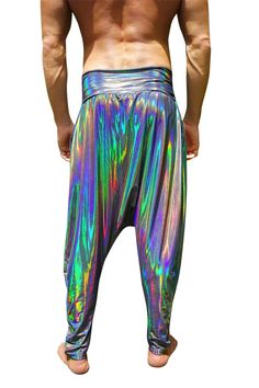 The harem pants that look and feel like liquid rainbows. Our modern take on the Hammer Pants from the 80s, these holographic drop crotch harem pants are as comfortable as they are fabulous. Prismatic from every angle, lightweight and silky soft, these trousers are perfect for lounging or rave outfits. FEATURES: Drop crotch style Side pockets Stretchy, forgiving waistband Made with super lightweight spandex that feels effortless, like you're wearing nothing Sheer proof Breathable Unisex and delic Iridescent Stretch Bottoms For Summer, Multicolor Disco Bottoms For Festival, Metallic Rave Bottoms For Summer, Summer Rave Metallic Bottoms, Stretch Multicolor Harem Pants For Festival, Holographic Pants, Mens Harem Pants, Womens Harem Pants, Aladin Pants