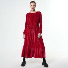 With a fit and flare silhouette, this long sleeved velvet dress is an outfit worth having.  The waist is elasticated and very comfortable for a long-day wear and the style of the dress gives you the opportunity to wear it on different occasions. Based on the accessories you choose to pair it with, this loose autumn dress can look casual or formal. This garment closes with a button at the neck. MATERIAL: 90% polyester, 10% spandex  CARE: Dry clean only. Never iron. Use steam to remove wrinkles. Red Winter Dress, Red Winter Dresses, Velvet Dress Long Sleeve, Long Velvet Dress, Red Casual Dress, Sleeved Velvet Dress, Velvet Dress Long, Long Sleeve Velvet Dress, Dress Velvet