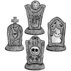 three cement tombstones with skulls and crosses on them