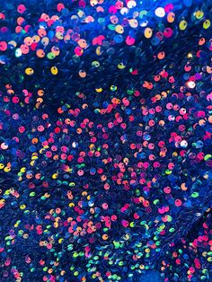 colorful bubbles floating in the air on a dark blue background with multicolored circles