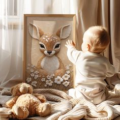 a baby looking at a painting of a deer with flowers on it and a teddy bear