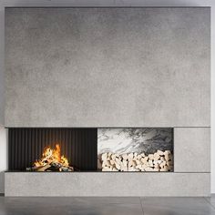 a modern fireplace with logs in the middle