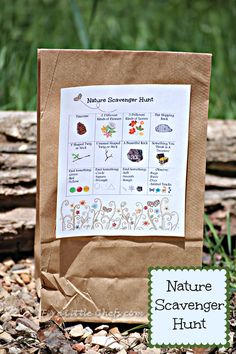 a brown paper bag filled with lots of different things on top of grass and dirt