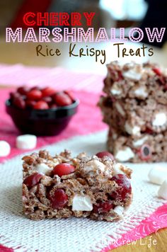 cherry marshmallow rice krispy treats are sitting on a table with marshmallows