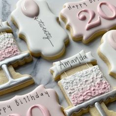 decorated cookies with pink and white frosting for a 20th birthday cake or anniversary party