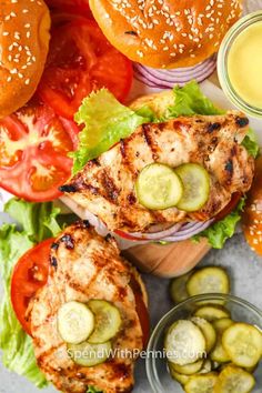 grilled chicken burgers with pickles, tomatoes and cucumbers