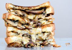 a stack of grilled cheese and mushroom sandwiches