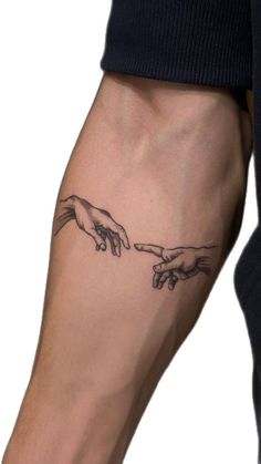 two hands touching each other with one hand holding the other's finger tattoo on both arm