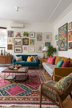 Mismatched furniture, vibrant gallery walls, and patterned rugs bring personality to this eclectic living room 🎭.  #EclecticStyle #LivingRoomDecor #BoldDesign #UniqueSpaces Mismatched Gallery Wall Living Room, Living Room With Mismatched Furniture, Eclectic House Decor, Mismatched Furniture Living Room, Boho Eclectic Living Room Ideas, Eclectic Home Living Room, Mismatched Decor, Modern Maximalist Decor, Modern Eclectic Home