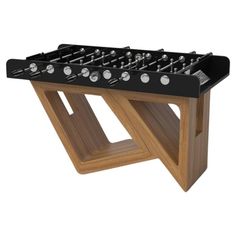 a foosball table that is made out of wood and has metal knobs