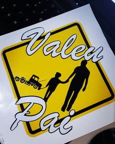 a yellow and black sign that says valley pag with a man holding the hand of a woman