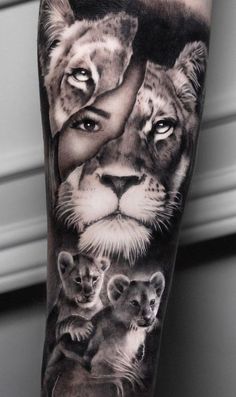 a man's arm with a lion and two cubs on it, both in black and white