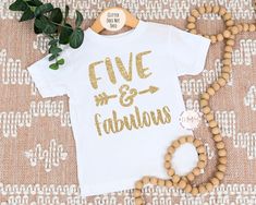 Five and Fabulous Shirt. Glitter design (glitter does not shed) If you would like to customize this with a different glitter color (gold glitter displayed on shirt), please include that as a note at checkout. A glitter color chart is available as a listing photo. --------------------------------------------- PROCESSING TIME: 3-5 business days (M-F) before an item ships. If you need something sooner, please send a message before purchase. SIZING: Size charts are available in the photos. CARE INSTRUCTIONS: Wash inside out. Hang to dry or tumble dry low. Do not iron on design. No fabric softener. --------------------------------------------- BACK TO DADDY MOMMY ME: https://www.etsy.com/shop/DaddyMommyMe Thank you for visiting Daddy Mommy Me! Five and Fabulous Shirt 5th Birthday Shirt 5 Birthd Gold Letter Print T-shirt For Party, 5 Birthday Shirt, Five And Fabulous, Ten Birthday, 10th Birthday Shirt, 5th Birthday Shirt, Birthday 10, Tenth Birthday, Glitter Birthday