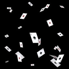 playing cards are falling down in the air