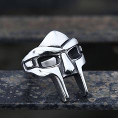 * Note: For back order items, please allow 20 working days of crafting time. Daniel Dumile, best known by his stage name MF... Doom Ring, Mf Doom Ring, Doom Mask, Mf Doom Mask, Dr Doom, Doctor Doom, Metal Mask, Wedding Ring Bands Set, Mens Stainless Steel Rings