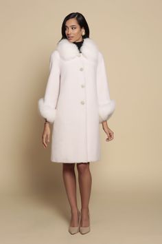 A timeless classic. The 'Monroe' coat is crafted from 100% ethically sourced lambswool, trimmed at the collar and sleeves with the dream-like softness of the highest quality faux fur. Graceful gold-tone metal and lustrous pearl buttons make this piece one truly elegant affair.   Features:   Four graceful gold-tone and pearl metal buttons 3/4 Sleeves Teddy-like 100% luxurious lambswool fabric 2 Side Pockets Outer: 100% Lambswool- 'Teddy' feel  Dry Clean or Hand Wash Faux Fur Cape, An Affair To Remember, Wool Trench Coat, Fox Fur Coat, Teddy Coat, Cape Coat, Pearl Buttons, Faux Fur Coat, Elegant Outfit