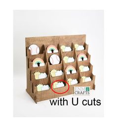 a cardboard display case with cut outs for baseballs and rainbows on it that says next day shipping