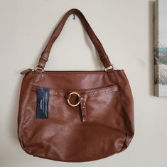 Tommy Hilfiger Faux Leather Purse. Brown In Color. Nwt. Couple Black Marks On Side. May Or May Not Be Cleaned Off. Across 16" Top To Bottom 12" Side 5 1/2" Bottom Approximately 8" Strap Drop 9" 1lb 6oz Tommy Hilfiger Leather Shoulder Bag For Daily Use, Chic Tommy Hilfiger Leather Bags, Elegant Tommy Hilfiger Leather Shoulder Bag, Tommy Hilfiger Bags With Zipper For Everyday, Tommy Hilfiger Bags With Zipper Closure For Everyday Use, Elegant Tommy Hilfiger Leather Bag, Tommy Hilfiger Brown Shoulder Bag For Everyday, Tommy Hilfiger Everyday Tote Shoulder Bag, Everyday Tommy Hilfiger Bag With Zipper Closure