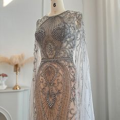 Warm Tips : 1. If the dress 100% real photos ? All the dresses you see are 100% real photos made by our factory ,you will get exactly what you see ,even more beautiful than photos :) 2. How long can I receive the dress ? Usually we can ship the dress within 7-15 days .Shipping time is about 5-7 working days by DHL ,Fedex,UPS,TNT etc.If you need it urgently , please tell us ,we can arrange a rush order for you :) 3. If have the tax? The taxes are charged by your country ( most countries doesn't c Dresses With Cape Sleeves, Dubai Evening, Arabic Women, Dubai Luxury, Wedding Party Dress, Arab Women, Cape Sleeves, فستان سهرة, Wedding Dress Sizes