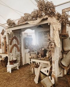 an old shed is filled with pots and pans