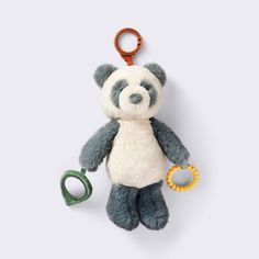 a stuffed animal with a keychain attached to it's neck and two rings