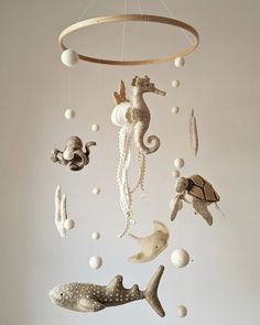 a mobile with sea animals hanging from it's sides