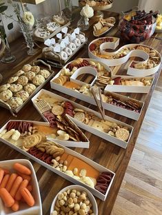 a table filled with lots of different types of snacks and desserts on top of it