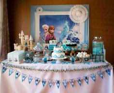 a frozen princess birthday party with blue and white decorations